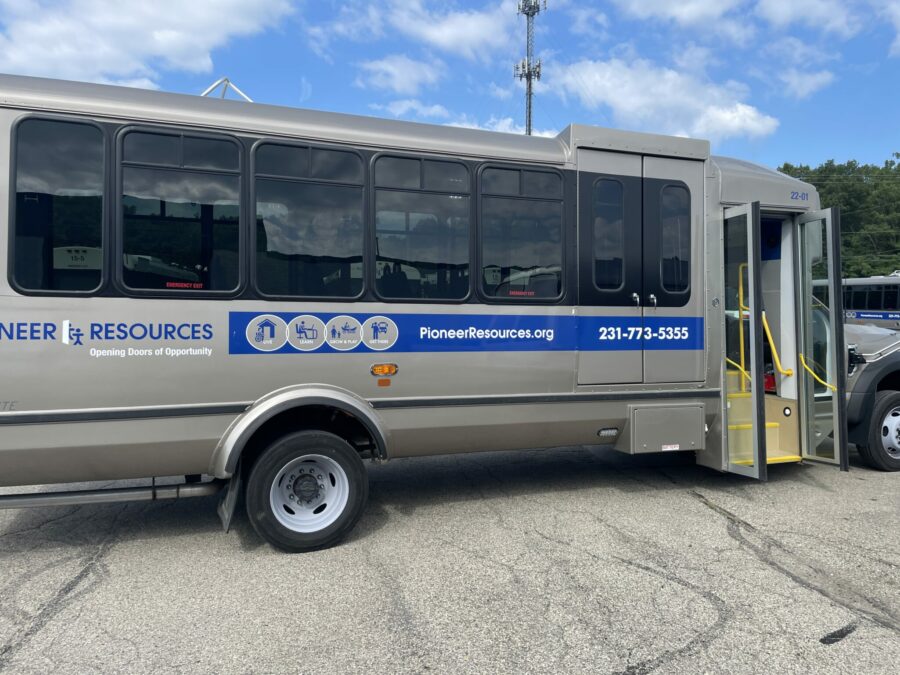 Photo of single bus with new logos - transportation services